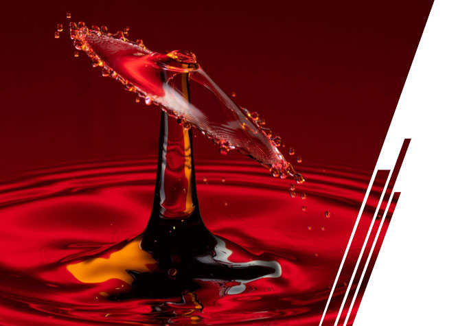 An image of a drop of oil dropping into a pan with ripples.