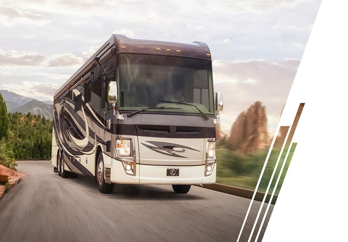 A motorhome travels along a road.